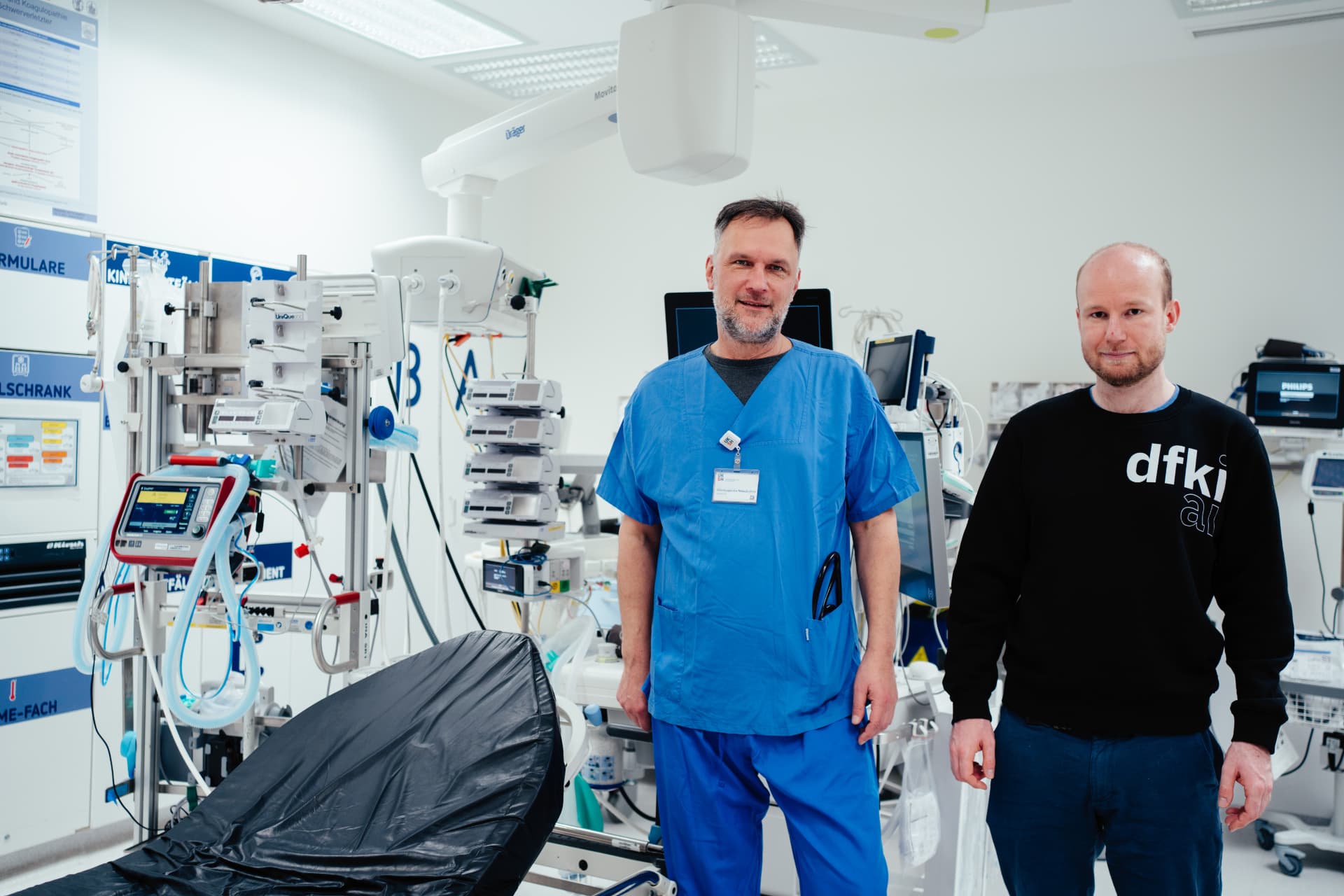 DFKI researcher and clinical partner in a hospital resuscitation room during a joint research project.